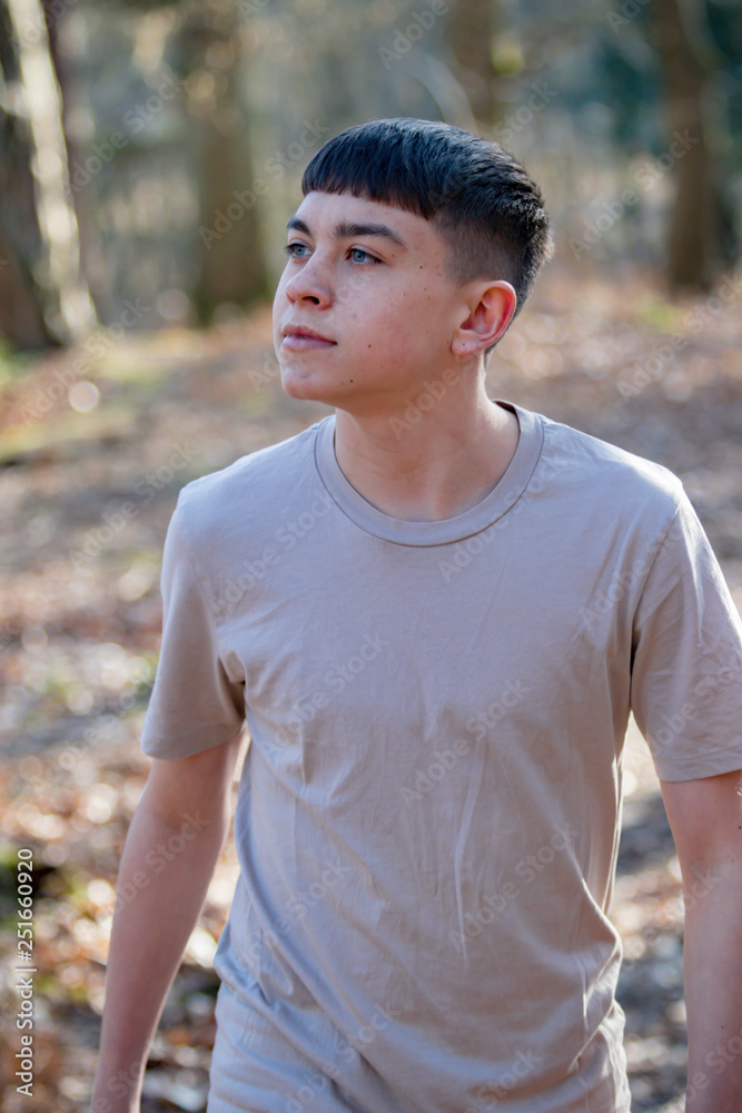Teenage boy outside on a bright Spring day Teenage boy outside on a bright Spring day