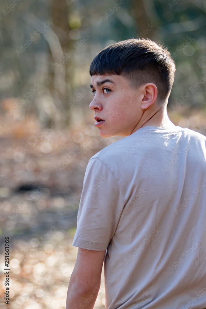 Teenage boy outside on a bright Spring day Teenage boy outside on a bright Spring day