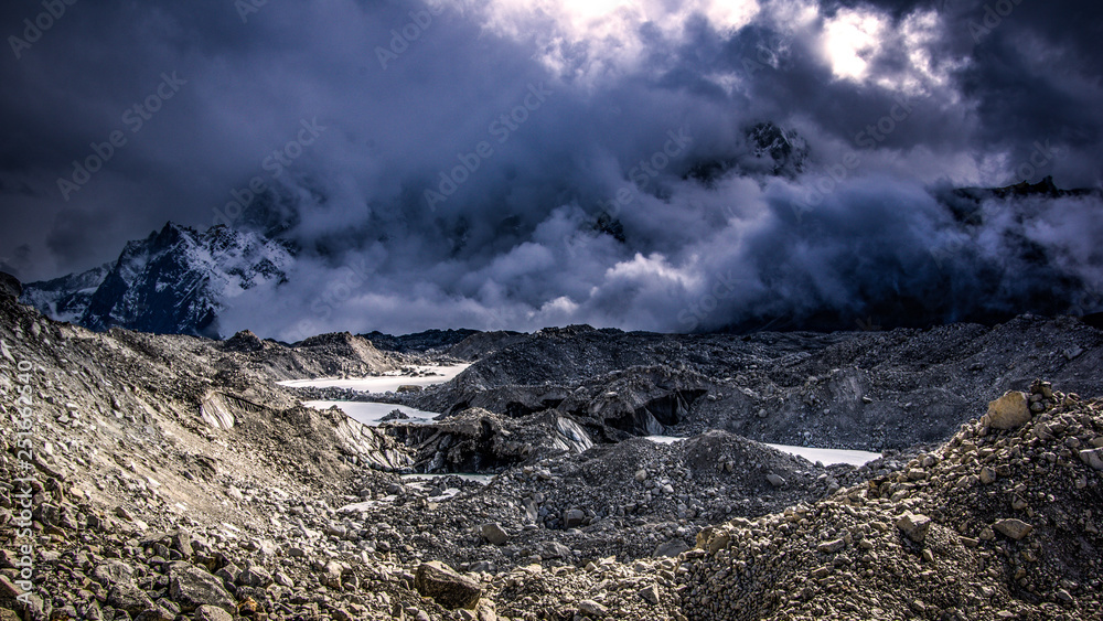 Landscape view of Khumbu Glacier with many dark clouds. Bad weather. Sagarmatha (Everest) National Park, Nepal. Landscape view of Khumbu Glacier with many dark clouds. Bad weather. Sagarmatha (Everest) National Park, Nepal.