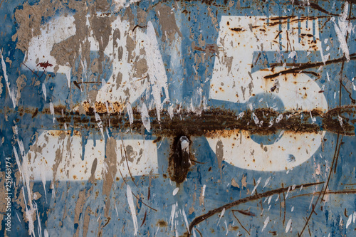 number twenty five painted on rusty blue metal, number 25, rusty background © ffmr