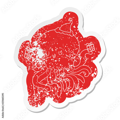 cartoon distressed sticker of a jellyfish in love wearing santa hat