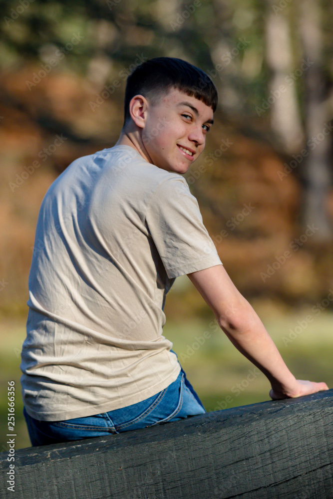 Teenage boy outside on a bright Spring day Teenage boy outside on a bright Spring day