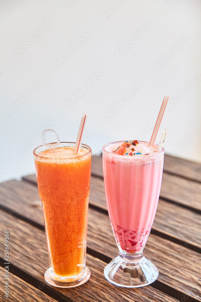 A glass of traditional Indian drink Faluda and fresh papaya juice. A glass of traditional Indian drink Faluda and fresh papaya juice.