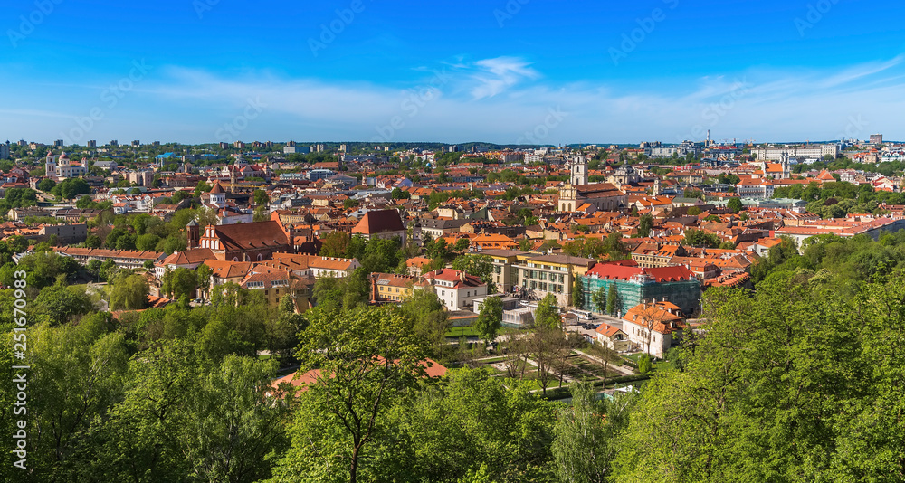  Vilnius city with tiled roofs cathedrals and churches modern buildings on the horizon