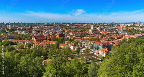  Vilnius city with tiled roofs cathedrals and churches modern buildings on the horizon