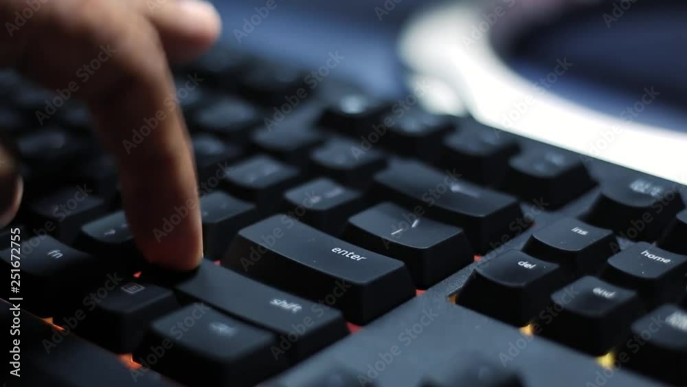 Pressing keys on computer gaming keyboard with RGB backlights Pressing keys on computer gaming keyboard with RGB backlights