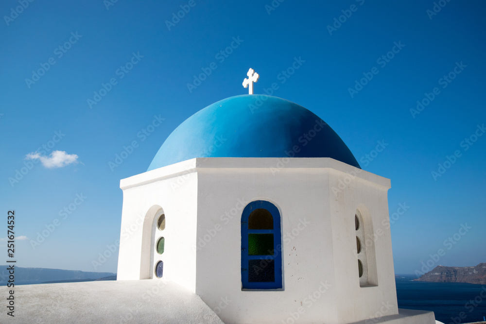 Greek blue dome white building cross