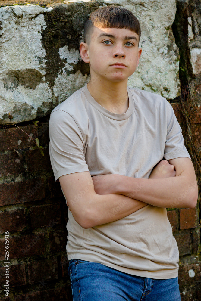 Teenage boy outside on a bright Spring day Teenage boy outside on a bright Spring day