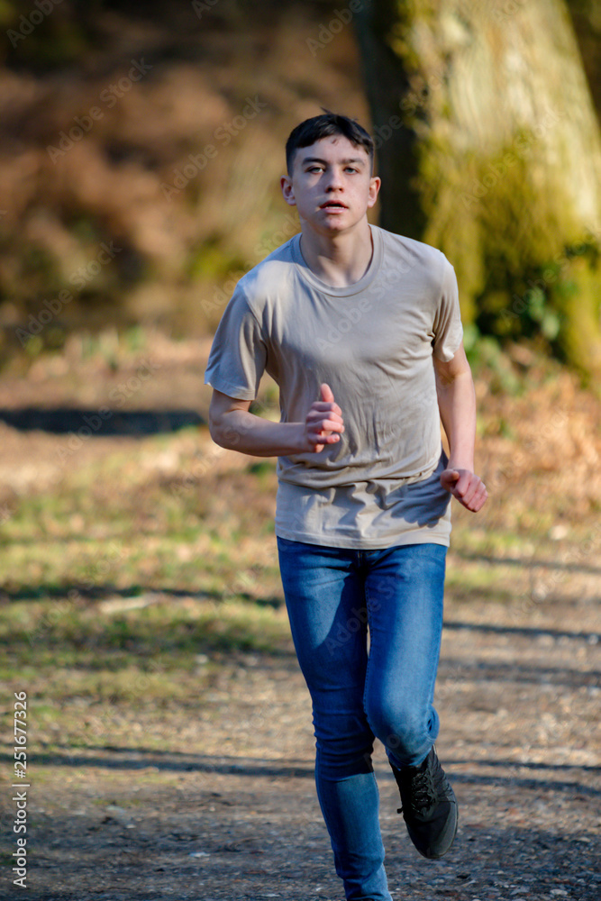 Teenage boy outside on a bright Spring day Teenage boy outside on a bright Spring day