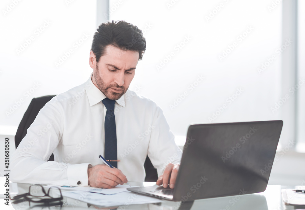 close up. serious businessman checking financial report close up. serious businessman checking financial report