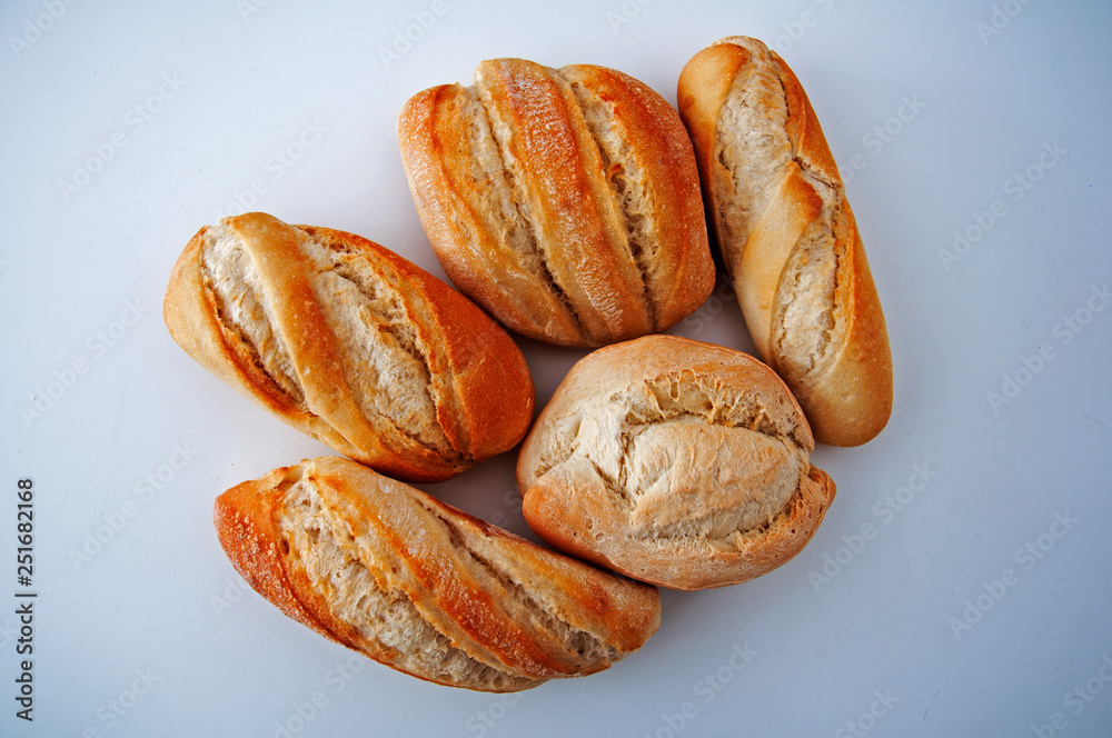 Five toasted small breads on the white background Five toasted small breads on the white background