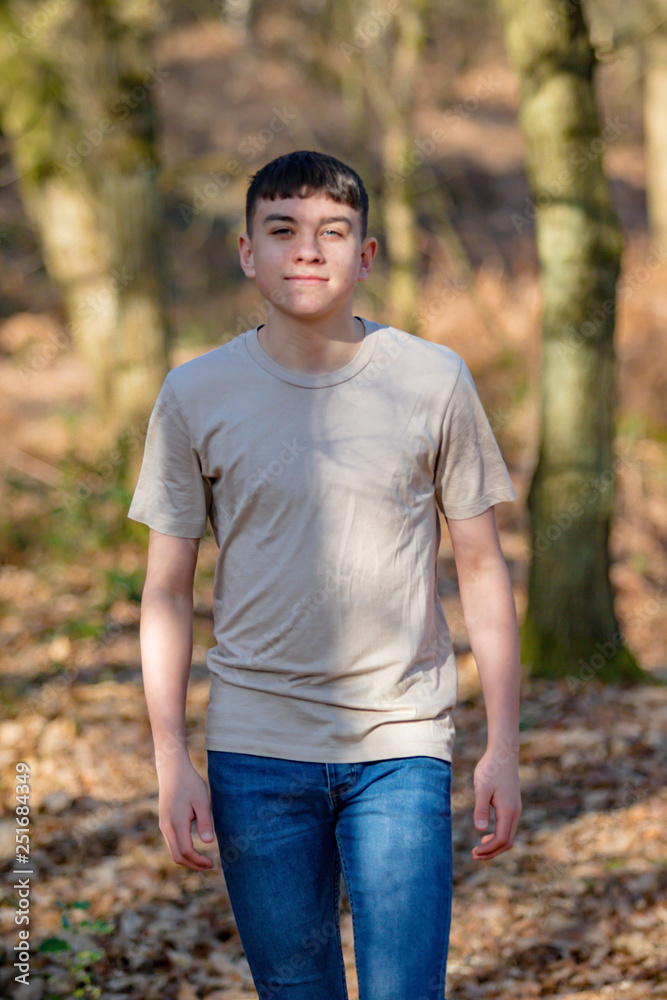 Teenage boy outside on a bright Spring day Teenage boy outside on a bright Spring day