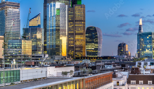 Aerial view of skyscrapers of the world famous bank district of central London after dusk