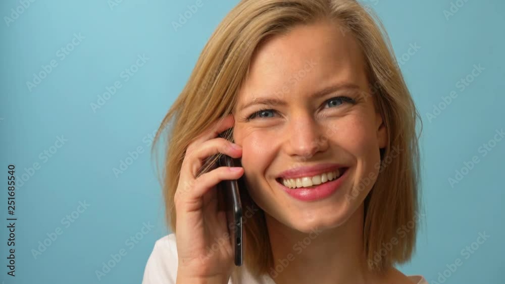 Happy conversation over the phone with pretty model Happy conversation over the phone with pretty model