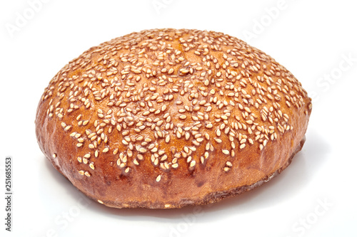 Hamburger bun with sesame seeds isolated on white background