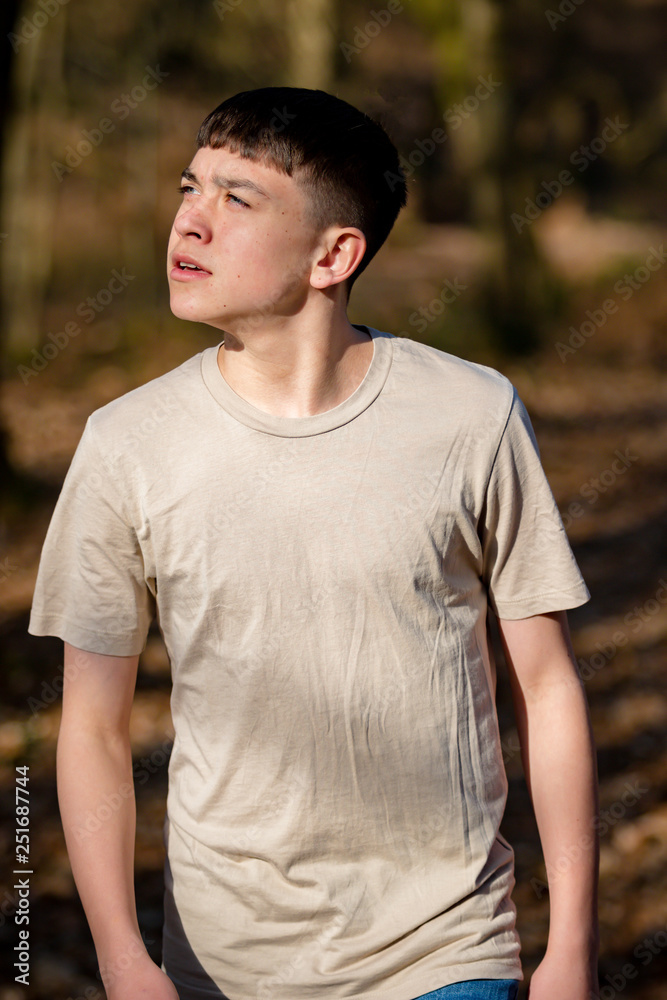 Teenage boy outside on a bright Spring day Teenage boy outside on a bright Spring day