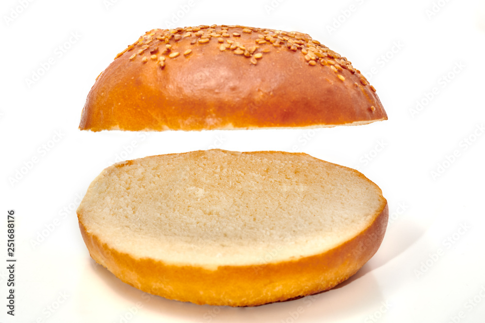 Burger bun cut in two isolated on white background