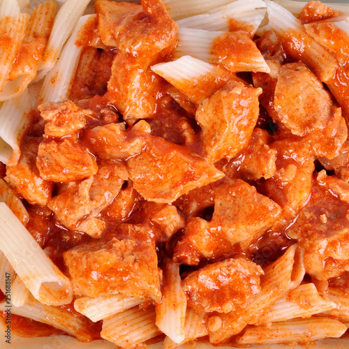 goulash with meat pieces and pasta close up