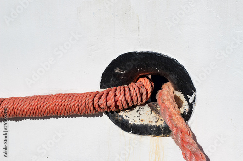 Mooring rope for fishing boat. Burt with a mooring rope. photo