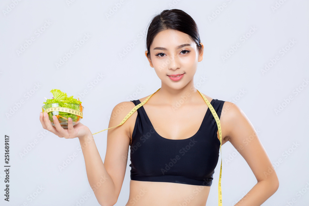 Portrait asian woman smiling holding and with measuring green apple fruit and beautiful body diet with fit isolated on white background, girl weight slim with cellulite, health and wellness concept. Portrait asian woman smiling holding and with measuring green apple fruit and beautiful body diet with fit isolated on white background, girl weight slim with cellulite, health and wellness concept.