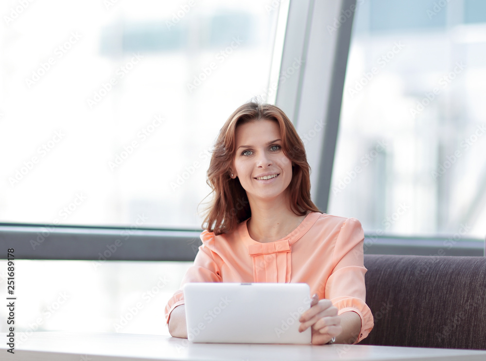 woman consultant using a digital tablet in the workplace in the office woman consultant using a digital tablet in the workplace in the office