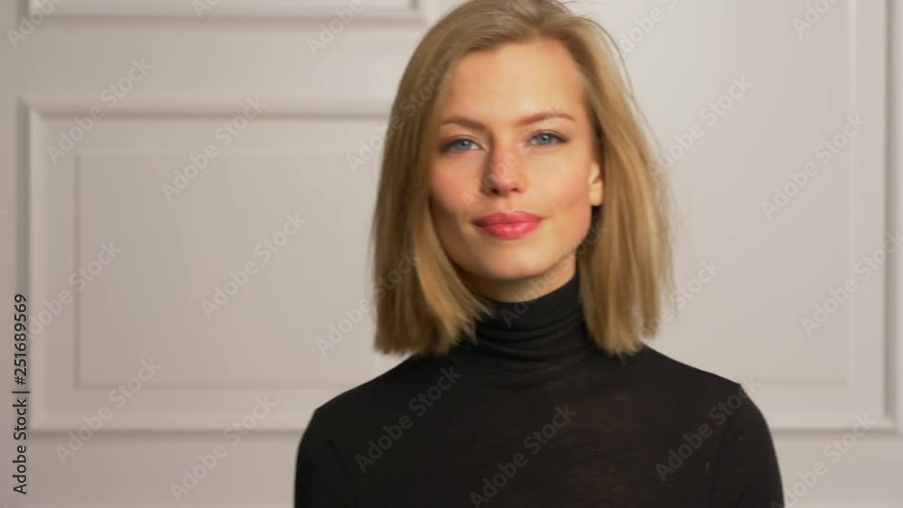 Model enters frame from left side to center then gives a big smile Model enters frame from left side to center then gives a big smile