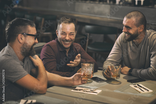 Photography Friends having meeting in bar, having fun and spending time together