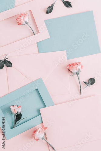 Wallpaper Mural Flowers composition romantic. Pink rose and envelopes on pale pink background. Flat lay, top view, copy space Torontodigital.ca