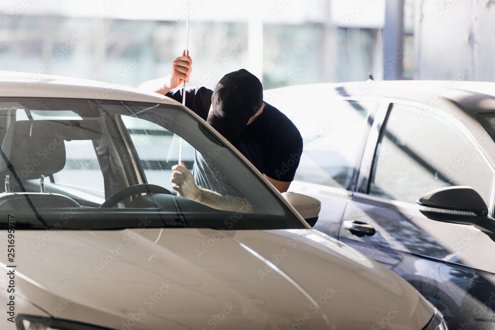 Carjacker stealing a car Carjacker stealing a car