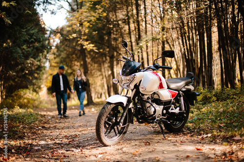 young couple on motorcycle laugh