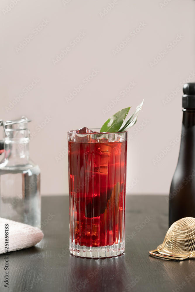 classy fancy bartender mixologist makes prepares alcohol drink cocktail bowtie raspberry
