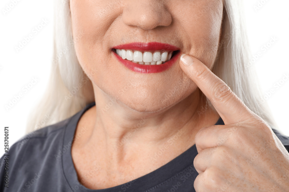 Obraz premium Smiling woman with perfect teeth on white background, closeup