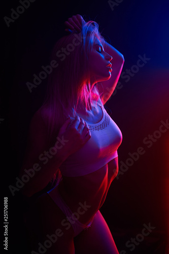 Pole dance girl with perfect body in black sexy lingerie. Night club concept