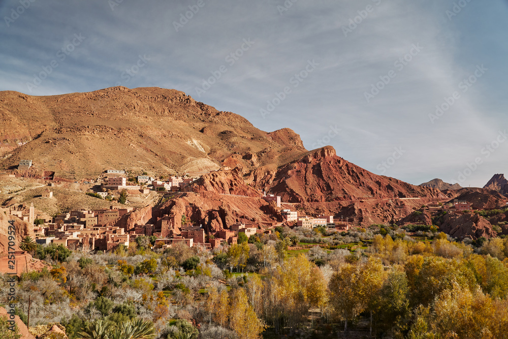 Red rocks and natural cliff in a rural town of Dades du Gorges canyon in Morocco dessert, Africa