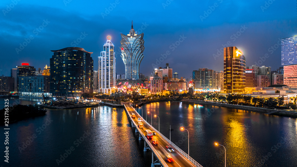 Fototapeta premium Macau cityscape at night, all hotel and tower are colorful lighten up with blue sky, Macau, China.