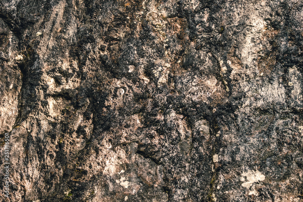 Stone wall. Fragment of gray rock as background Stone wall. Fragment of gray rock as background
