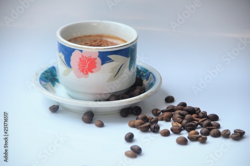 Cup of coffee with coffee beans 