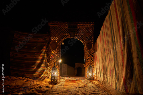 Beautiful atmosphere at the gateway to the desert campsite lit by traditional moroccan candles