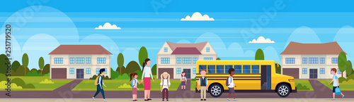 teacher with mix race pupils walking in yellow school bus pupils transport concept residential suburban street landscape background flat horizontal banner full length