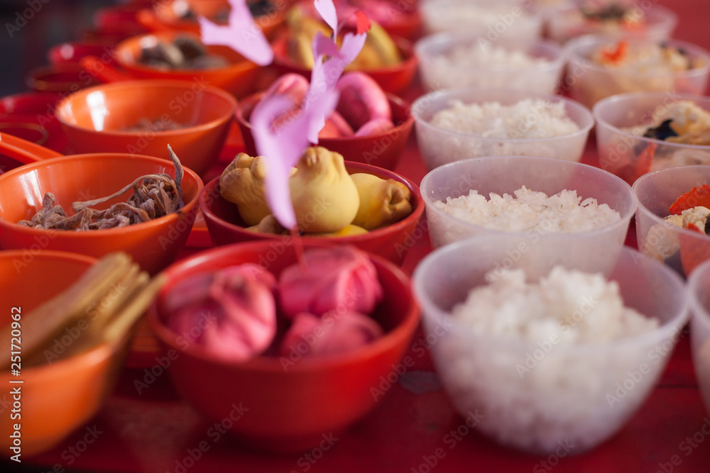 Food offerings on a table to appease the wandering spirits during the Chinese Hungry Ghost Festival Food offerings on a table to appease the wandering spirits during the Chinese Hungry Ghost Festival