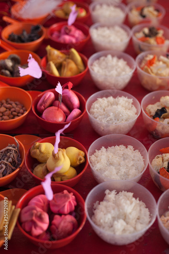 Food offerings on a table to appease the wandering spirits during the Chinese Hungry Ghost Festival  photo