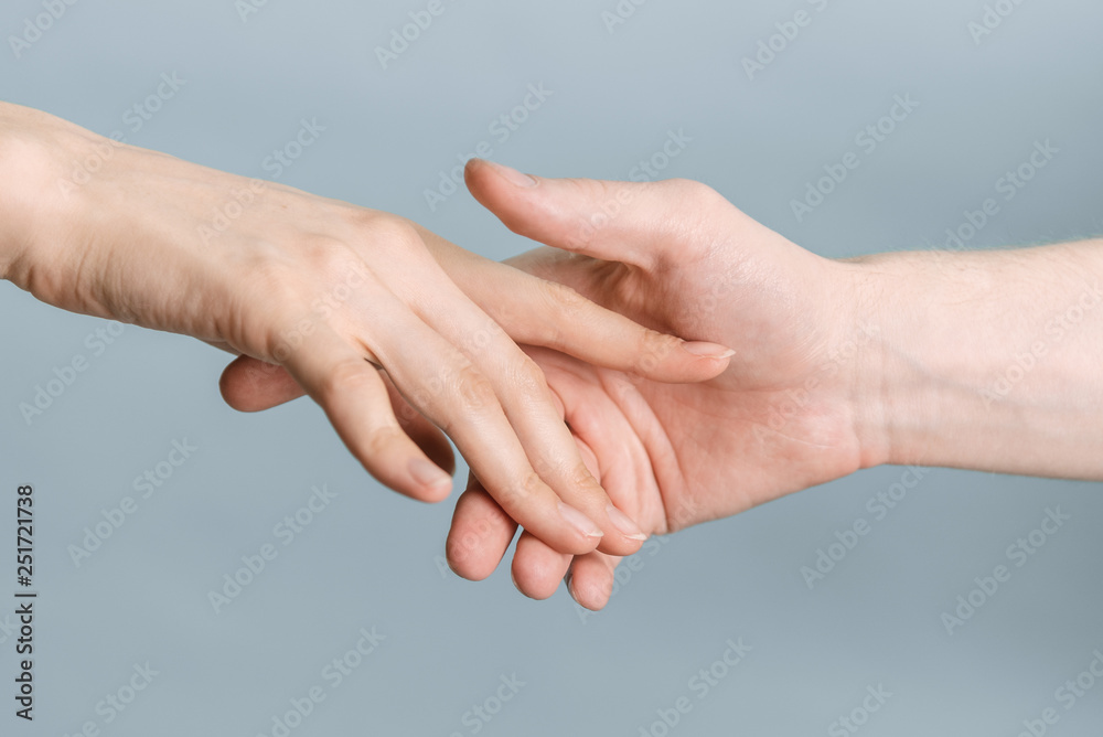 Hands of man and woman holding to each other, people relationship Hands of man and woman holding to each other, people relationship
