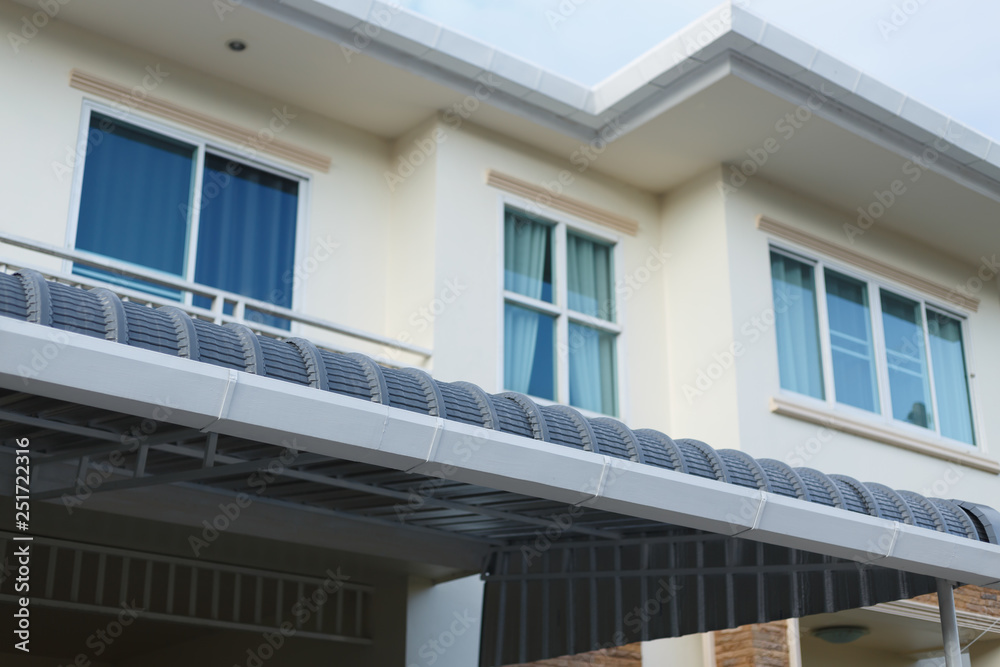 roof gutter on residential house building roof gutter on residential house building