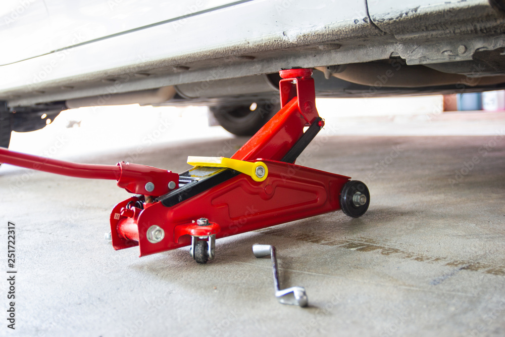 red tool jack lift car for repair check Maintenance of cars 