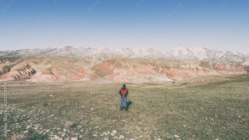 Traveler in the red mountains, hiking
