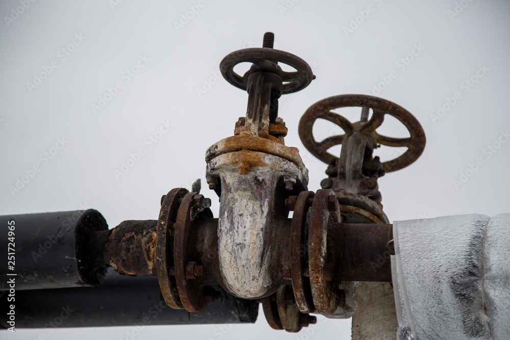 old rusty valve on the pipe. factory industry old rusty valve on the pipe. factory industry