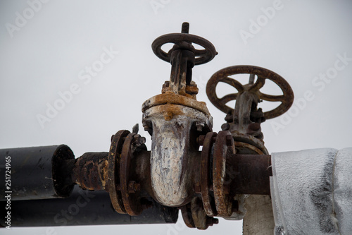 old rusty valve on the pipe. factory industry