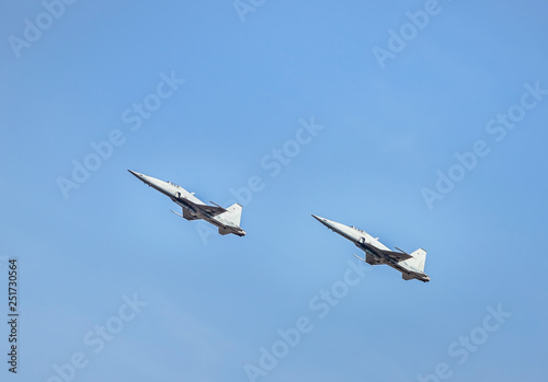 fighter jet military aircrafts flying with high speed  on blue sky background