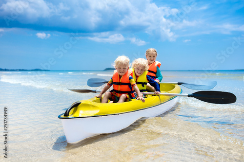 Kids kayaking in ocean. Children in kayak in tropical sea © famveldman