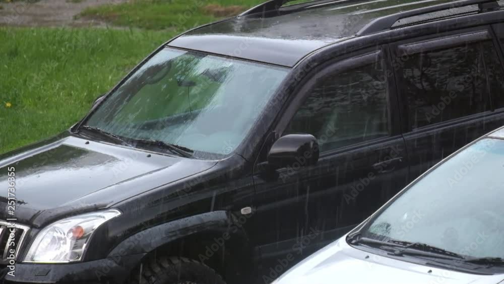 Cars in the parking lot in the rain Cars in the parking lot in the rain